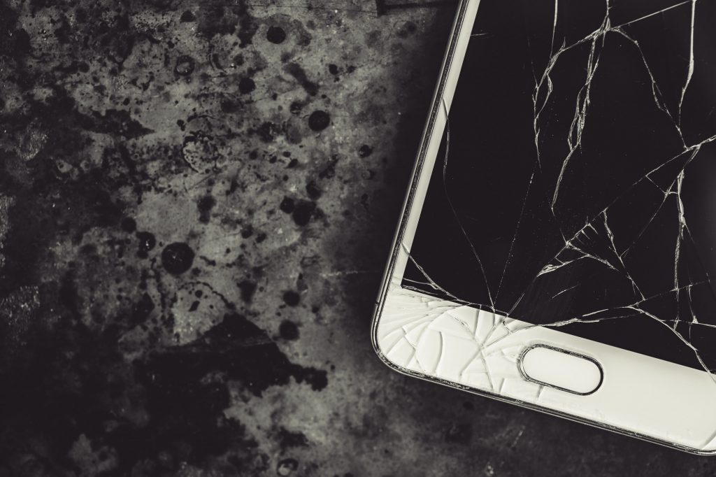 Smartphone with a broken screen.
